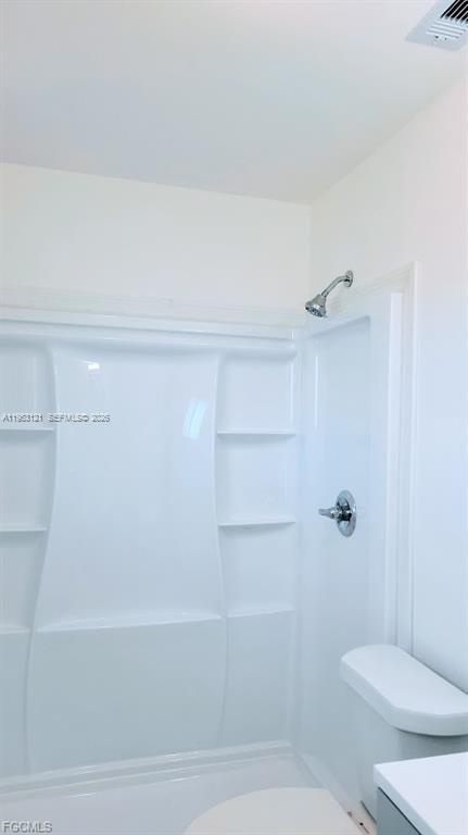 4008 Rye Court LaBelle, FL 33935 - Photo 8 of 12 a bathroom with a shower and a toilet