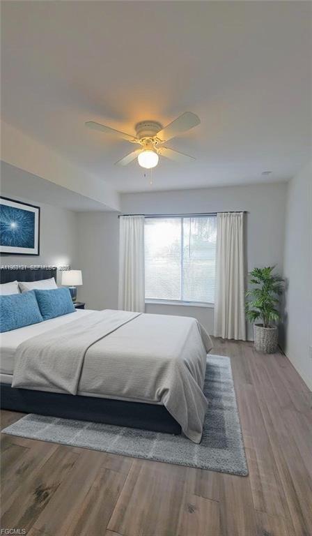 4008 Rye Court LaBelle, FL 33935 - Photo 9 of 12 a bedroom with a bed and a couch