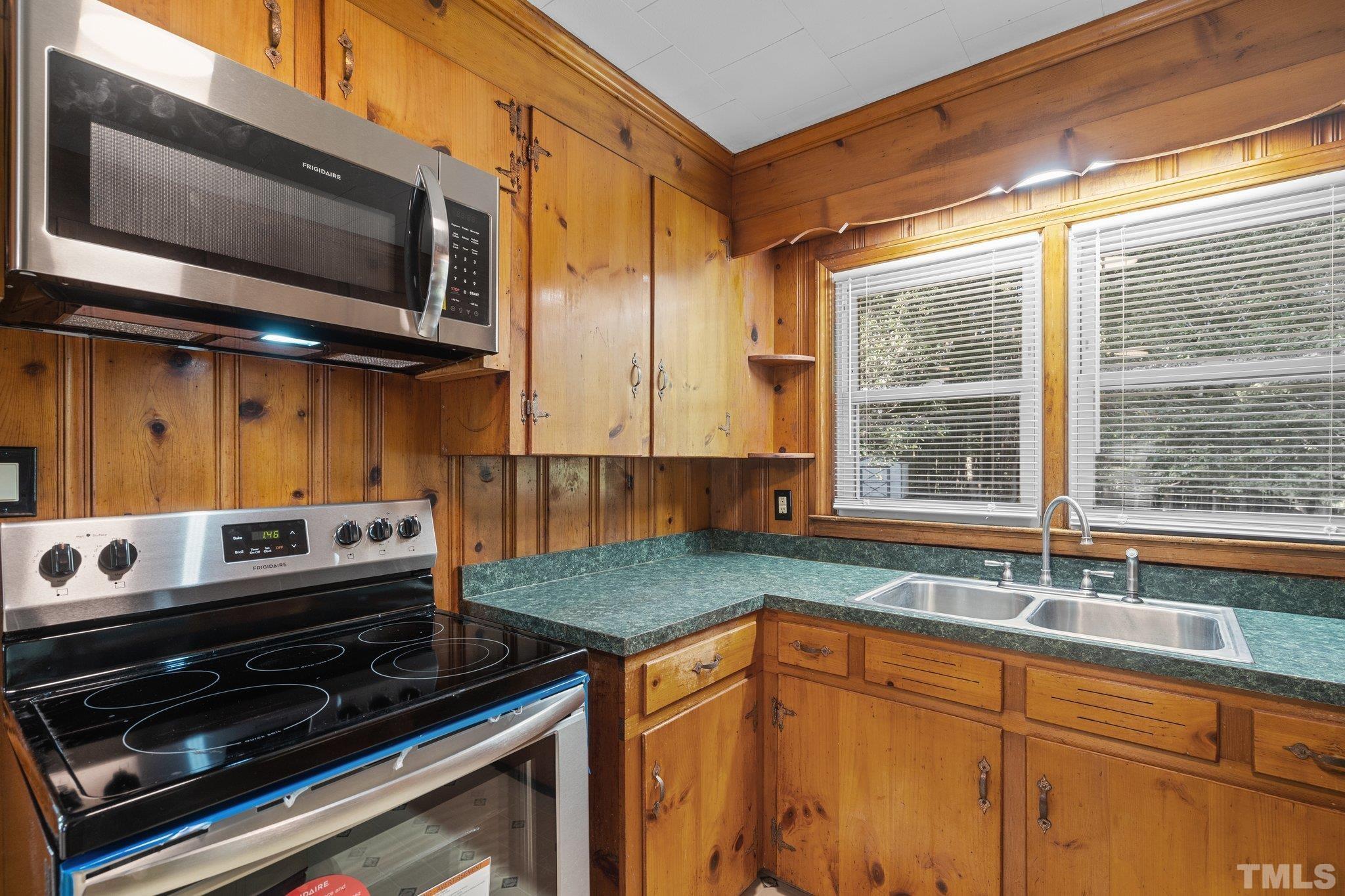 3645 Hicksboro Road Henderson, NC 27537 - Photo 14 of 37 a kitchen with a stove and a sink