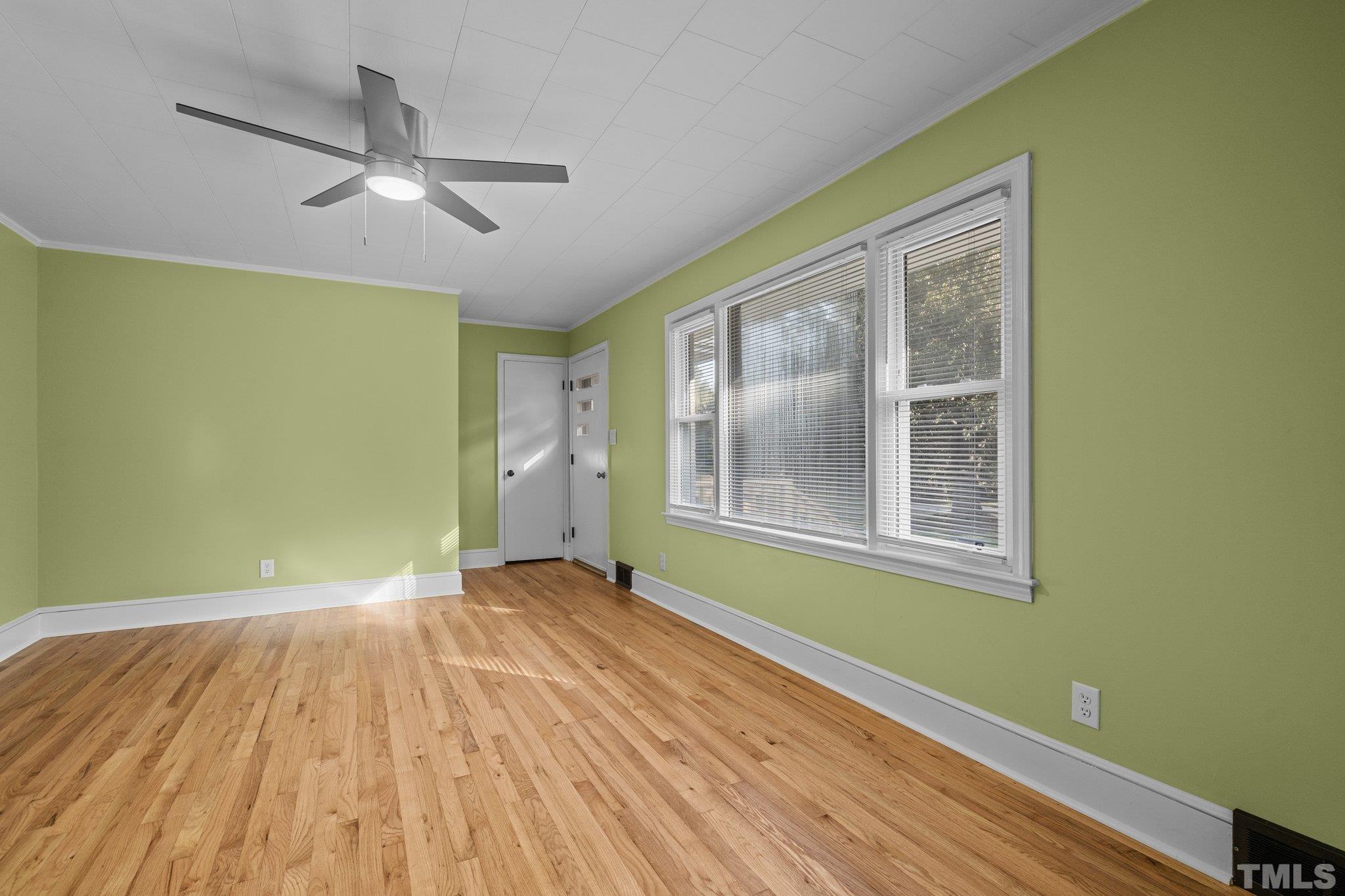 3645 Hicksboro Road Henderson, NC 27537 - Photo 16 of 37 a view of empty room with wooden floor and fan