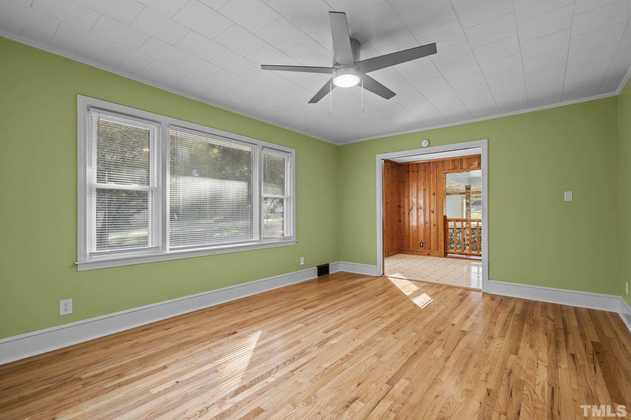 3645 Hicksboro Road Henderson, NC 27537 - Photo 19 of 37 a view of empty room with wooden floor and fan