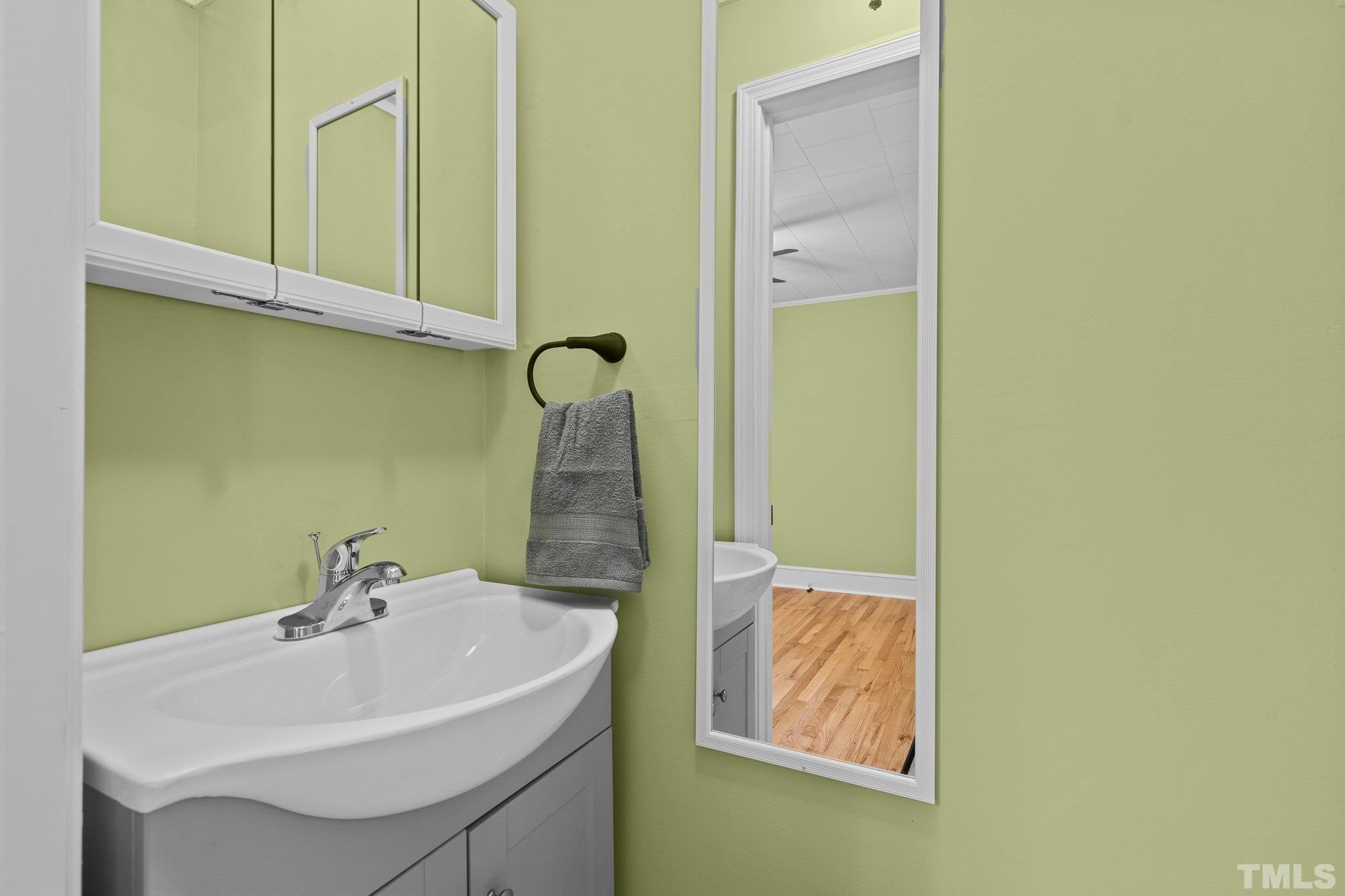 3645 Hicksboro Road Henderson, NC 27537 - Photo 25 of 37 a bathroom with a sink and a mirror