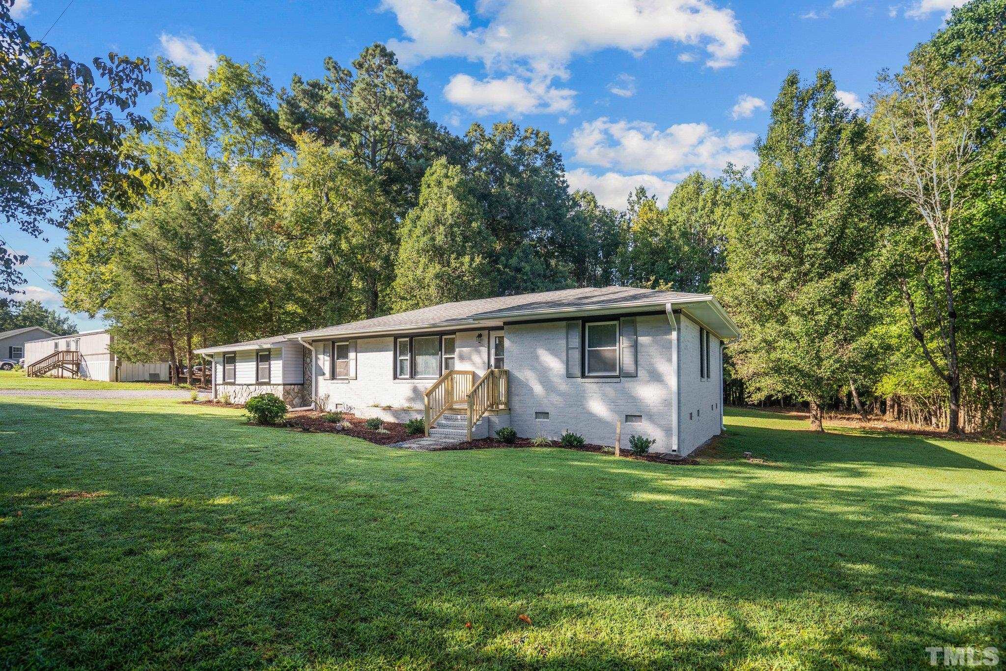 3645 Hicksboro Road Henderson, NC 27537 - Photo 3 of 37 a view of a house with a yard