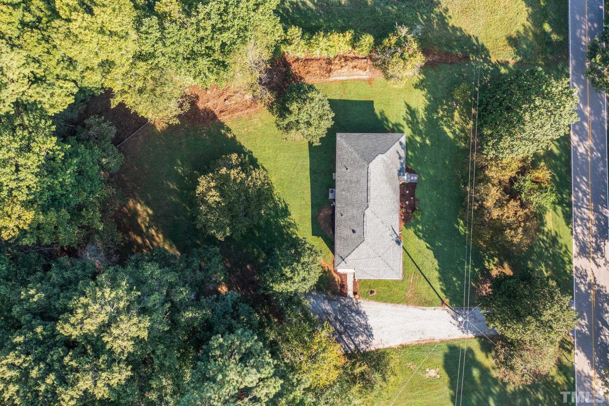 3645 Hicksboro Road Henderson, NC 27537 - Photo 34 of 37 an aerial view of a house with a yard and garden