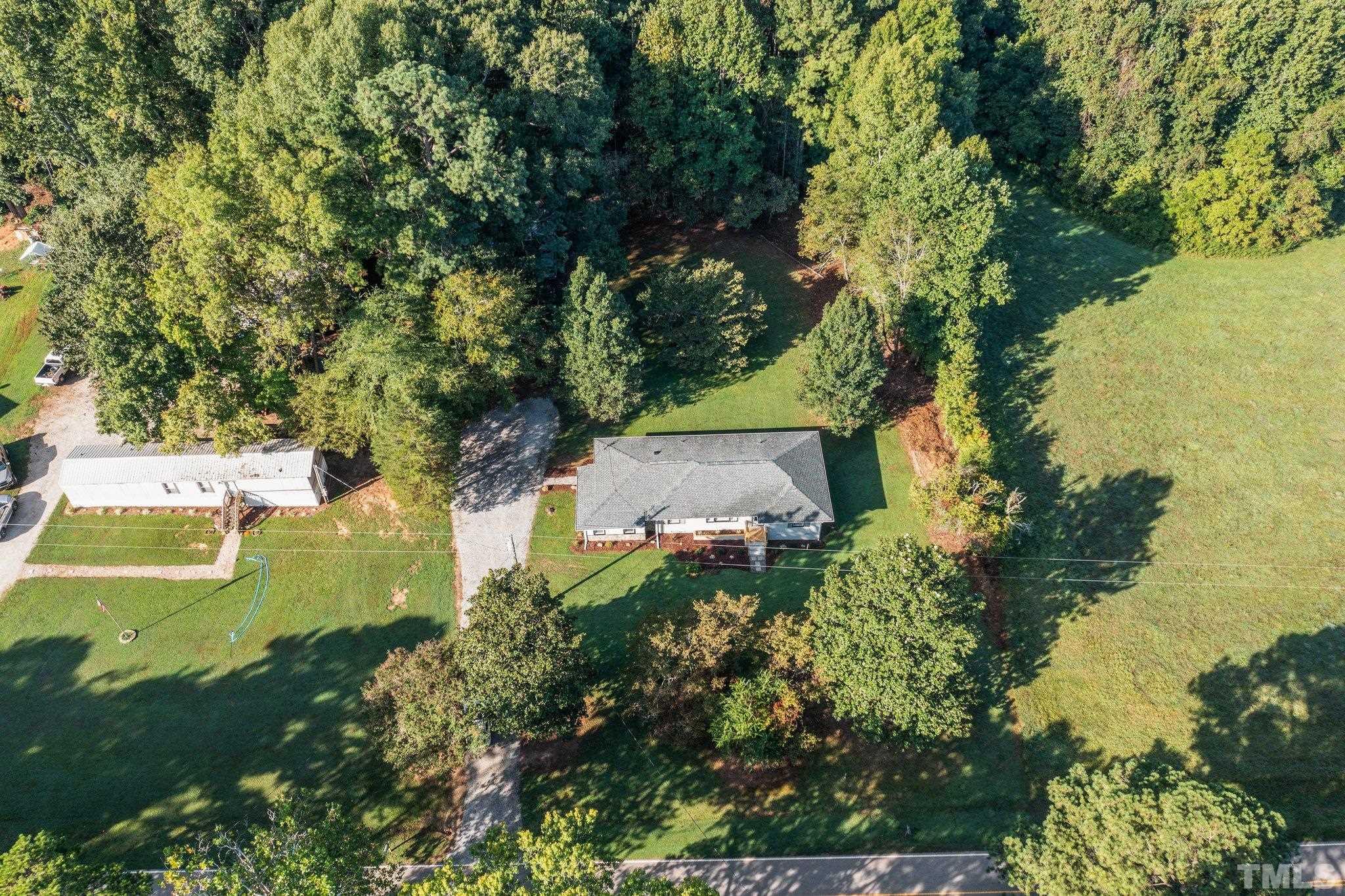 3645 Hicksboro Road Henderson, NC 27537 - Photo 36 of 37 an aerial view of a house with a yard