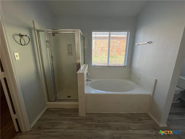 a spacious bathroom with a double vanity sink and a mirror