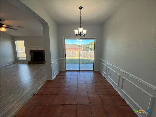 a kitchen with stainless steel appliances a stove refrigerator sink and microwave