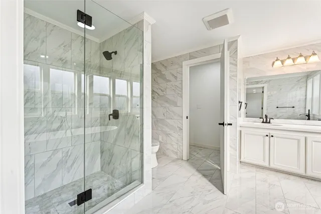a bathroom with a shower and a sink