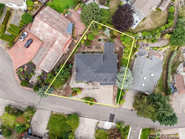 an aerial view of house with a yard