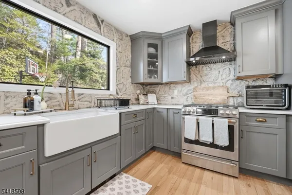 a kitchen with a sink cabinets and window
