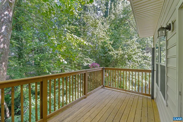 a view of balcony with wooden floor