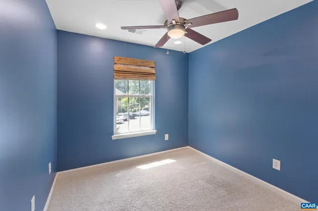 a bathroom with a granite countertop sink toilet a mirror a vanity and shower
