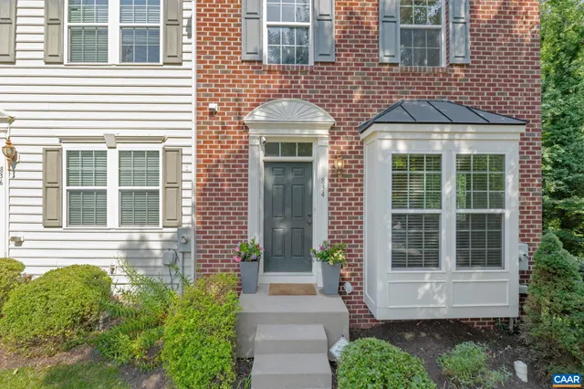 a sign broad in front of the house