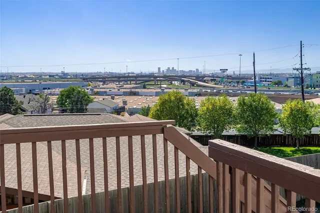 a view of a balcony with wooden floor