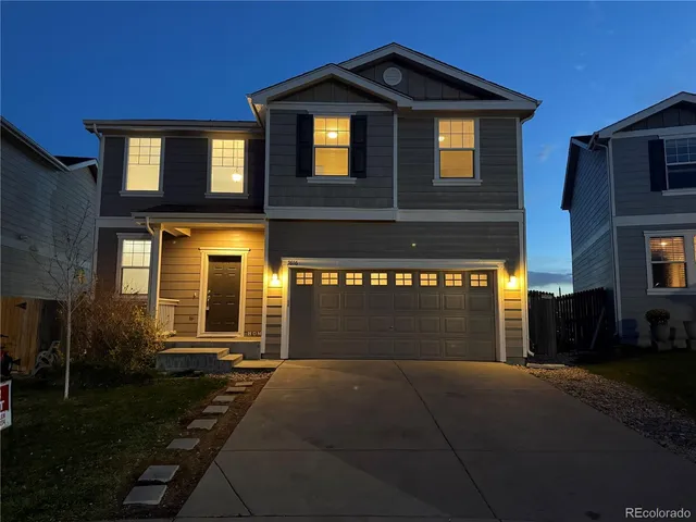 a front view of a house with yard