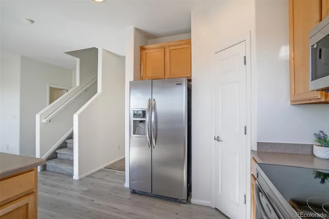 a view of a kitchen cabinets and wooden floor