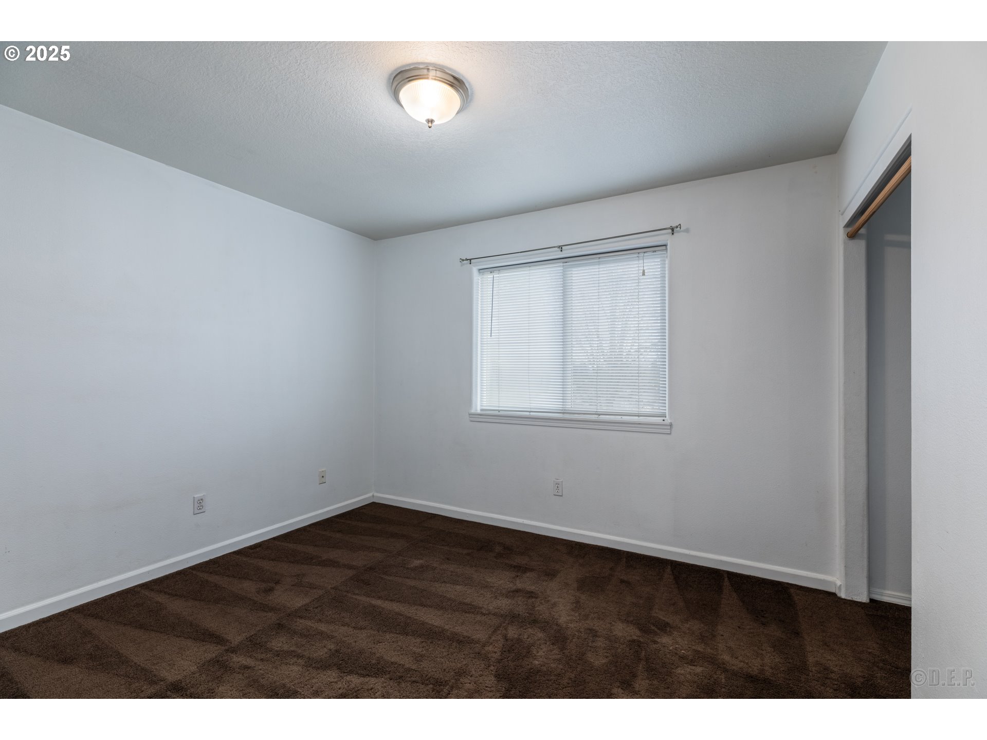 744 Oregon Street St. Helens, OR 97051 - Photo 7 of 11 a view of an empty room with a window