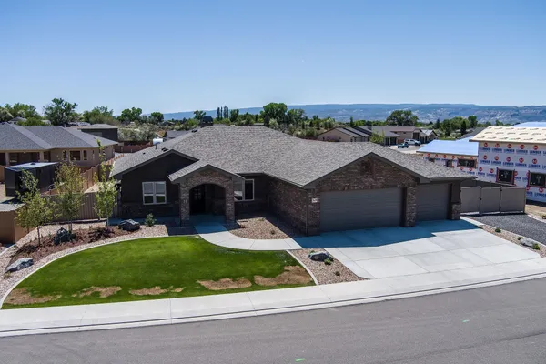 a aerial view of a house with a garden and trees