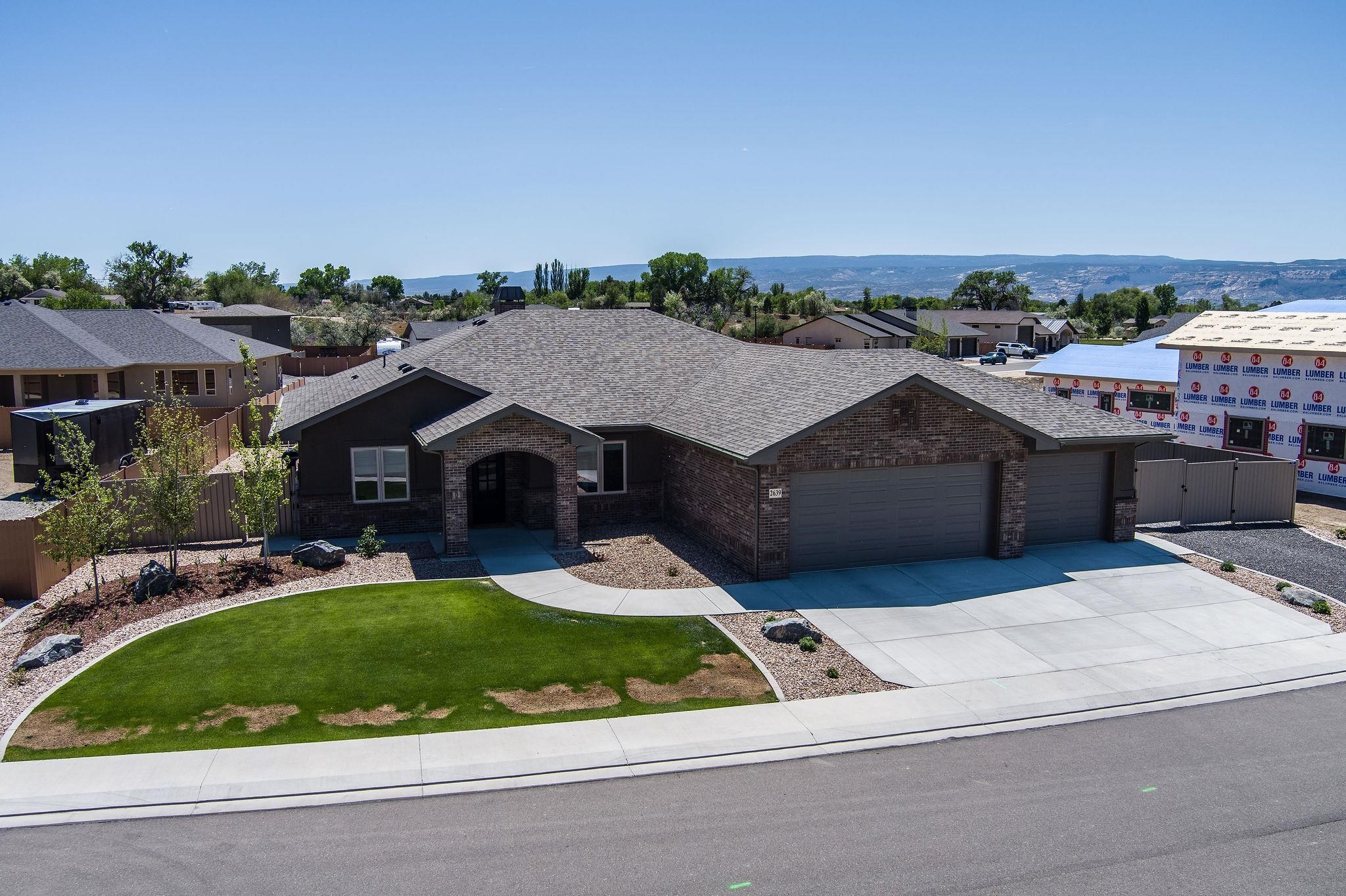 2639 Emerald Ridge Lane Grand Junction, CO 81506 - Photo 1 of 42 a aerial view of a house with a garden and trees