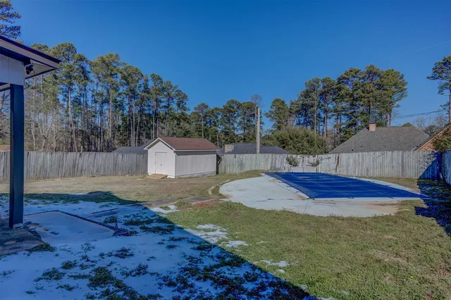 a spacious bathroom with a sink and a mirror
