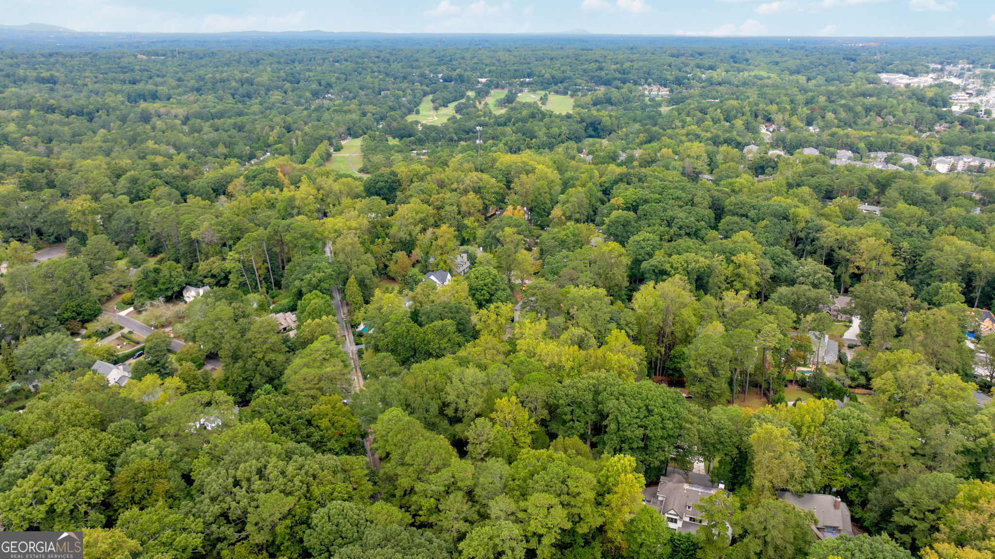 35 Putnam Circle Northeast Atlanta, GA 30342 - Photo 13 of 22 an aerial view of a houses with a lush green hillside