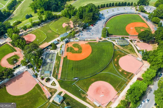 an aerial view of a house with a yard and garden