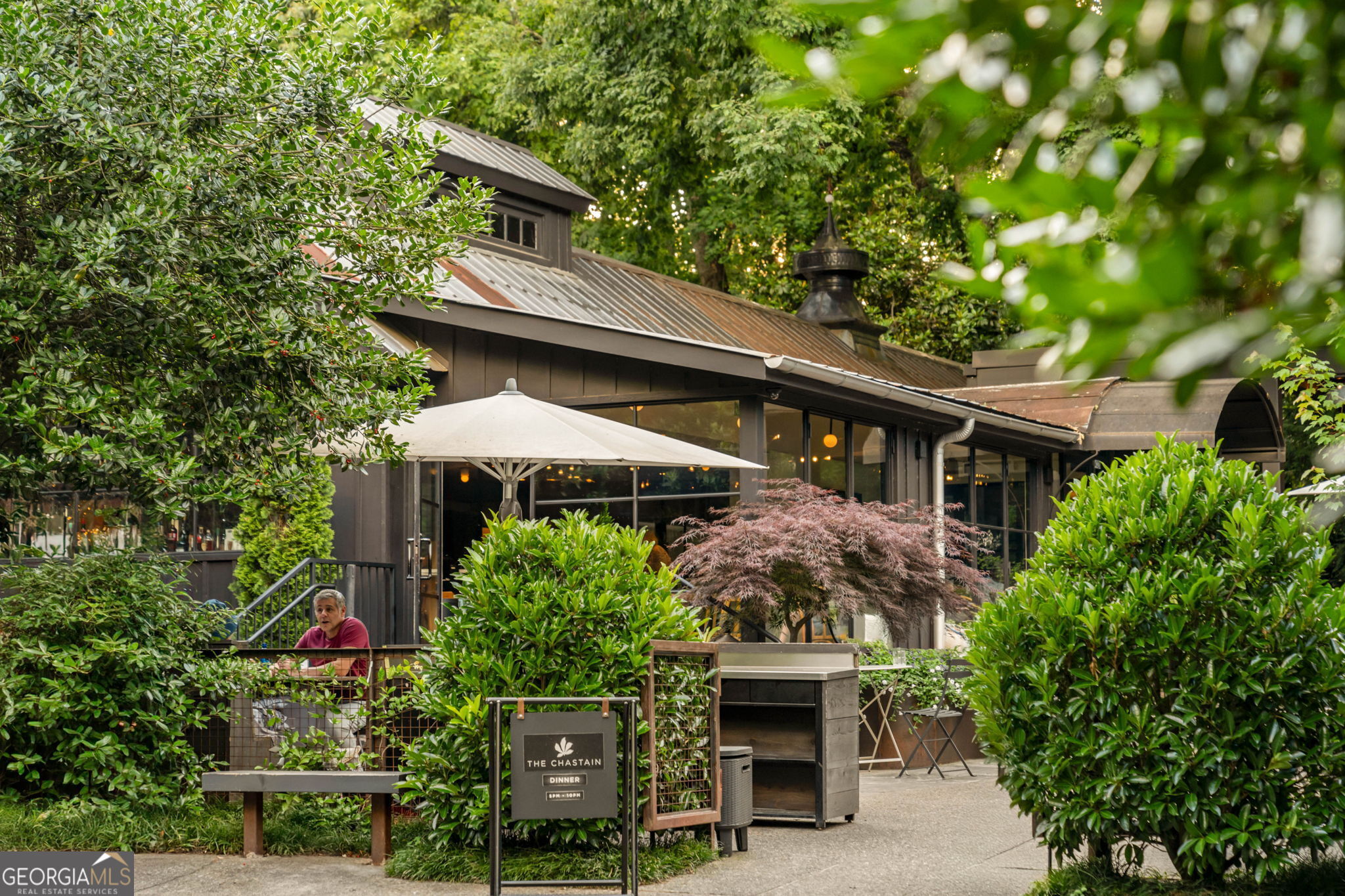 35 Putnam Circle Northeast Atlanta, GA 30342 - Photo 21 of 22 a front view of house with yard and trees around