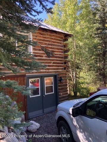 a front view of a house with parking area