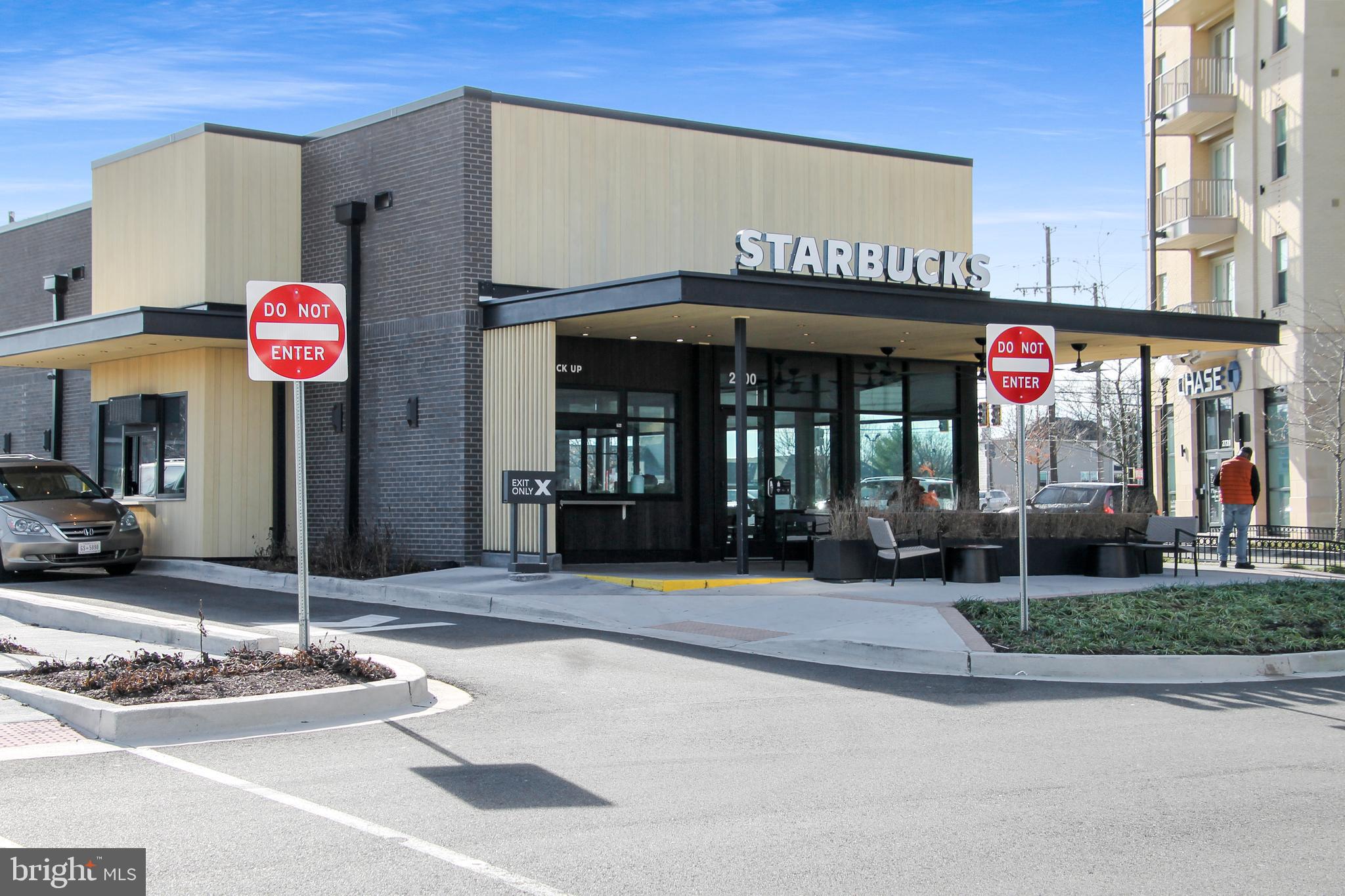 2103 Fort Davis Street Southeast, Unit A Washington, DC 20020 - Photo 18 of 22 a front view of multi story commercial building with retail shops