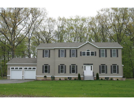 67 Higley Road Ashland, MA 01721 - Photo 1 of 28 a front view of a house with a garden