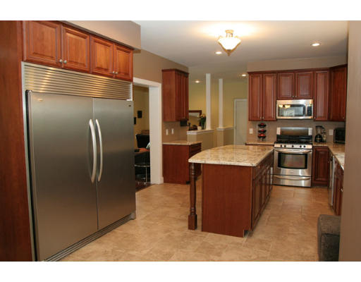 67 Higley Road Ashland, MA 01721 - Photo 8 of 28 a kitchen with stainless steel appliances granite countertop a refrigerator a stove a sink and a microwave