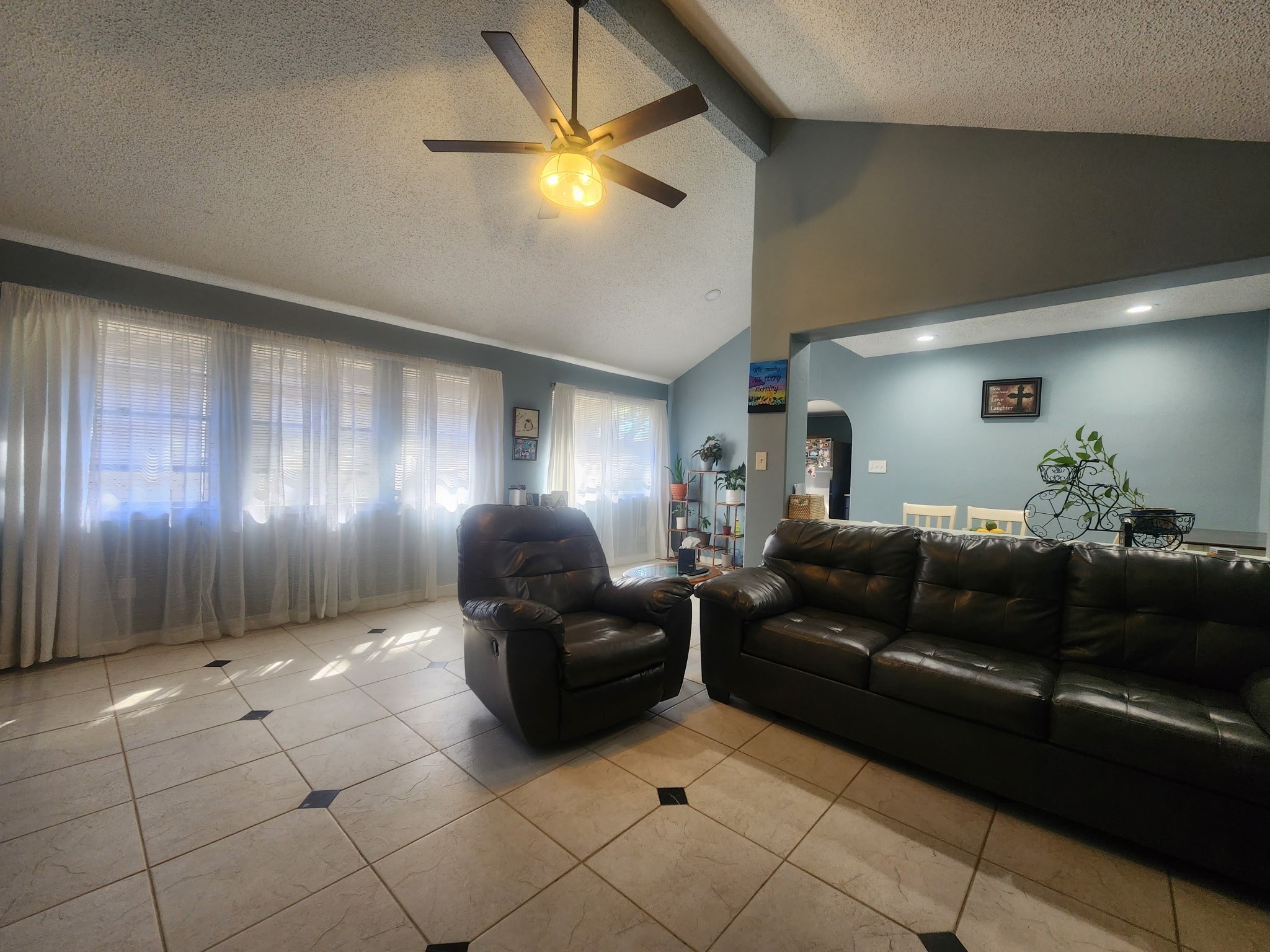 13715 Vickston Lane Houston, TX 77014 - Photo 4 of 12 a living room with furniture and a chandelier