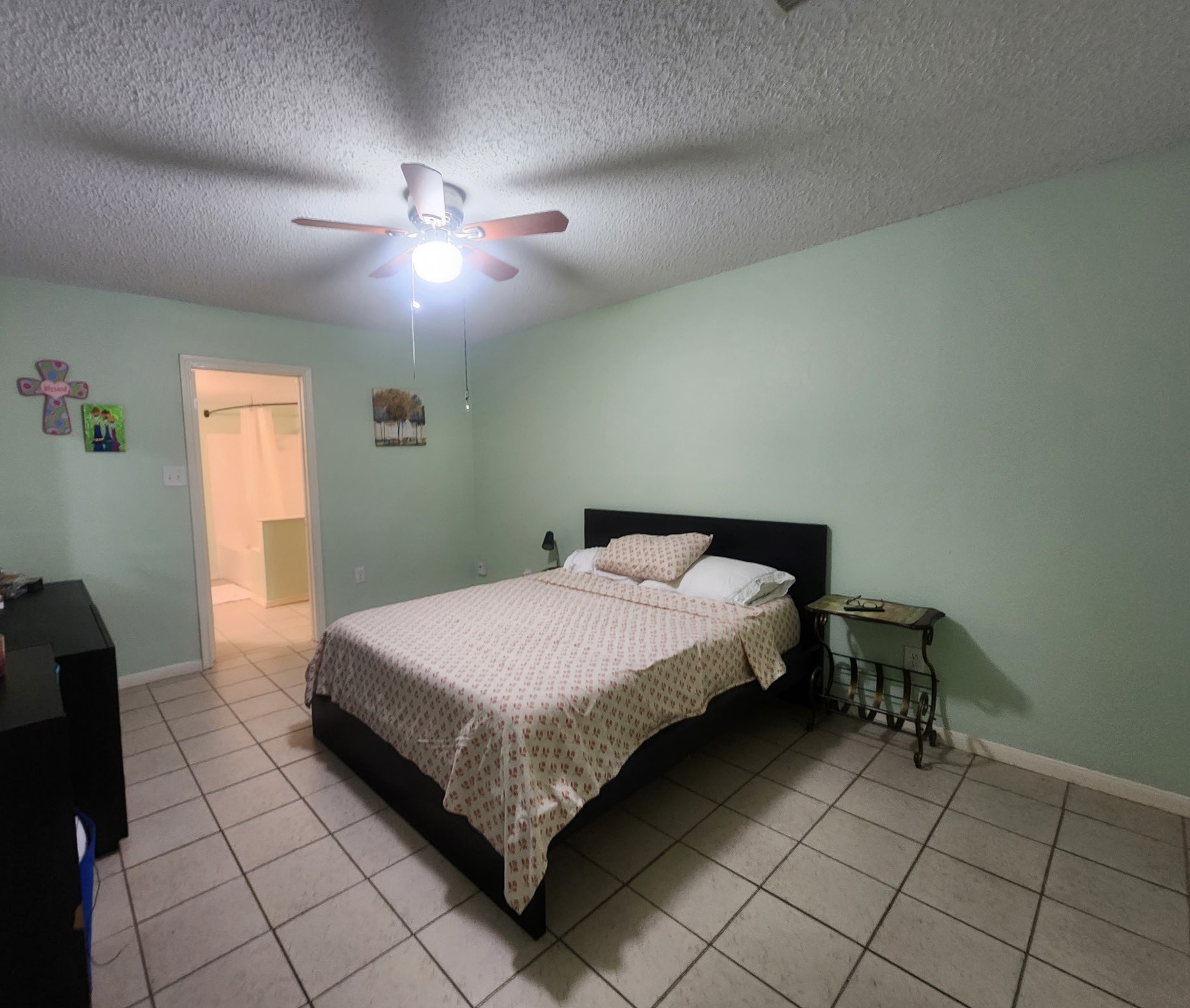 13715 Vickston Lane Houston, TX 77014 - Photo 5 of 12 a bedroom with a bed and window