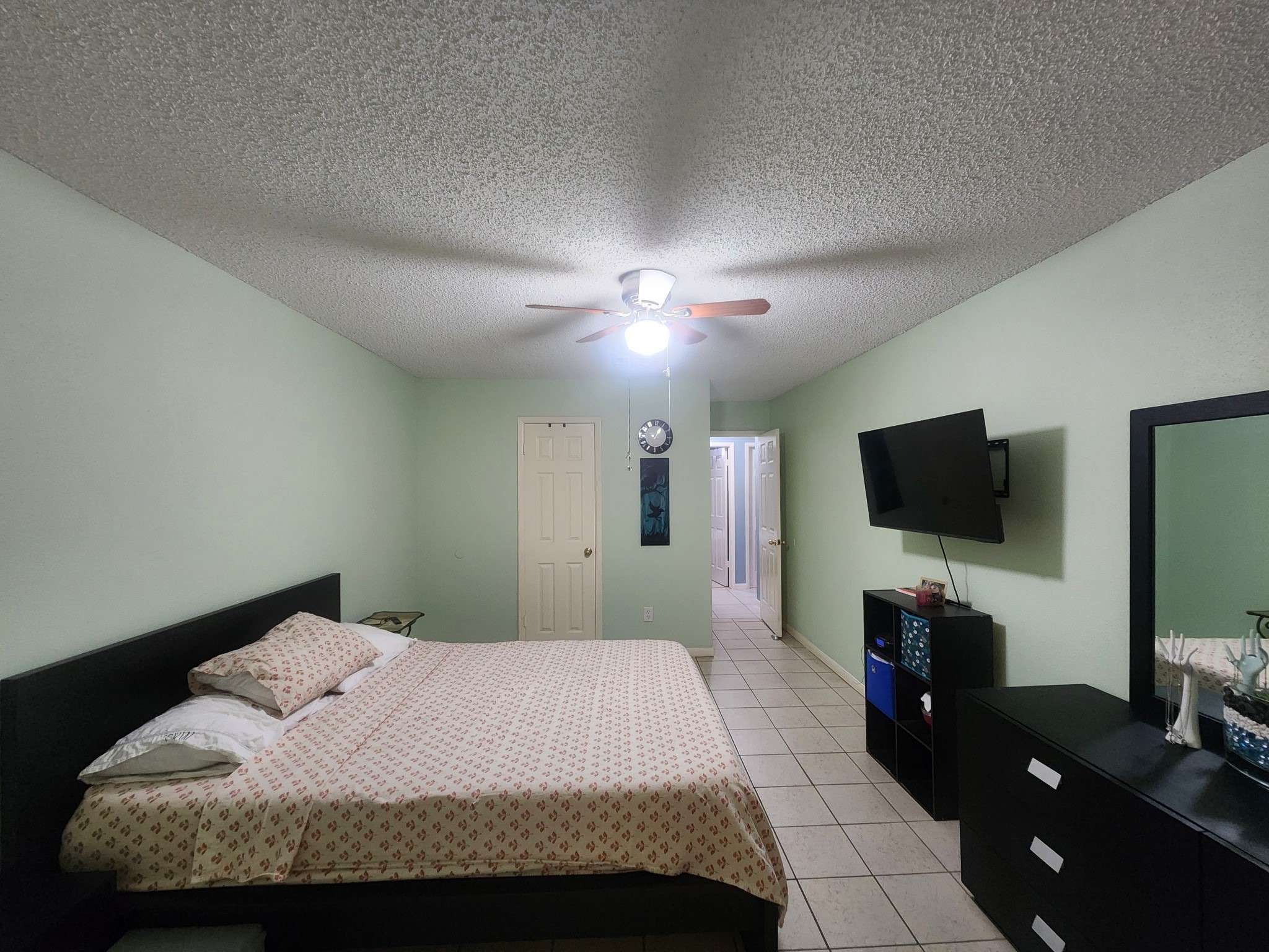 13715 Vickston Lane Houston, TX 77014 - Photo 7 of 12 a bedroom with a bed and a flat screen tv