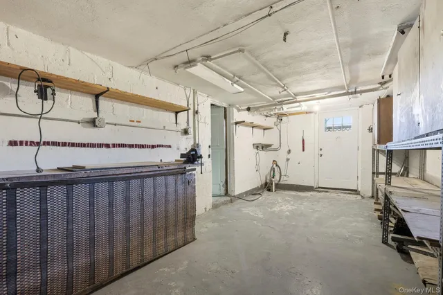 a view of a white house with a yard covered in snow