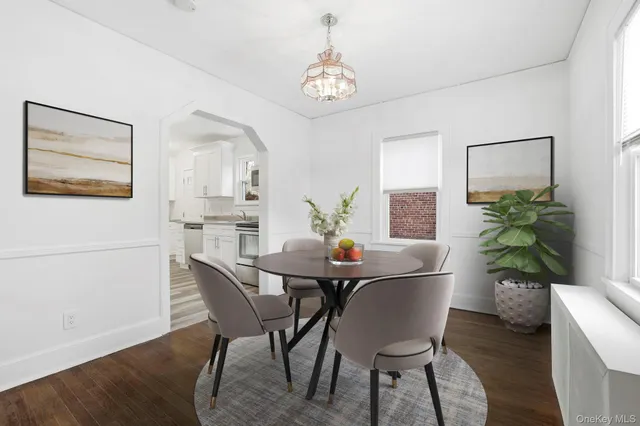 a dining room with furniture and window