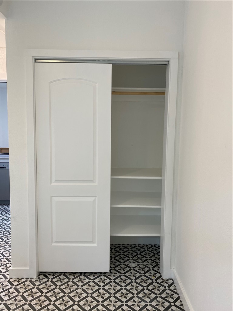 2605 Enfield Road, Unit 109 Austin, TX 78703 - Photo 18 of 33 Wood Closet, Sliding Doors and Shelves
