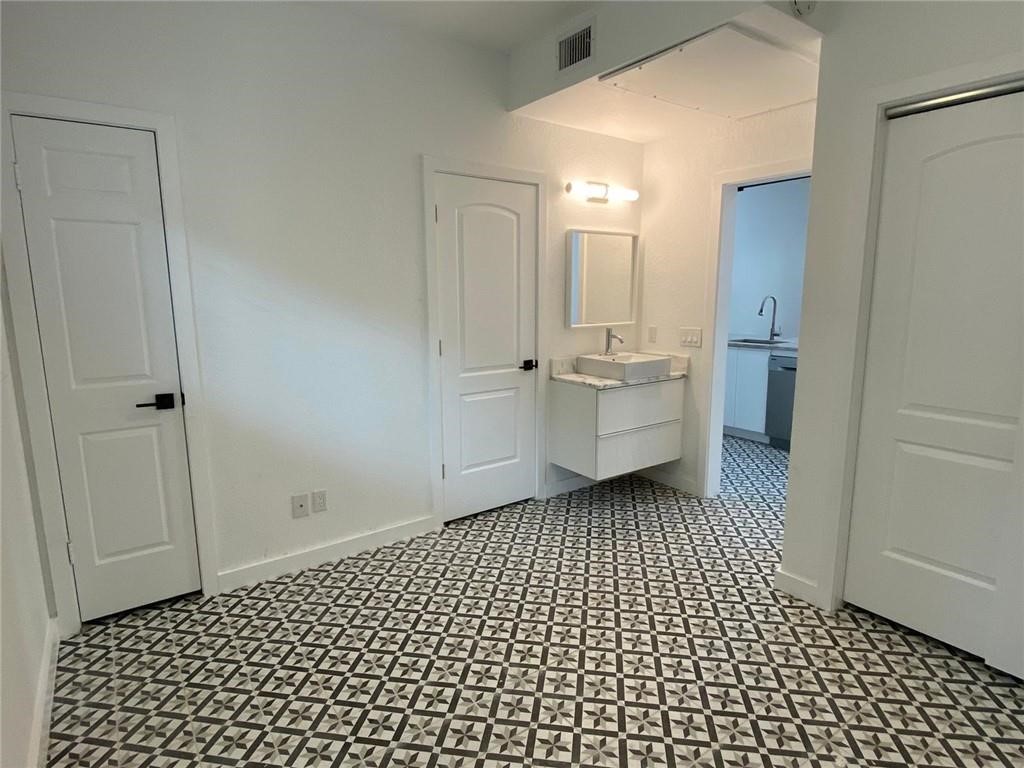 2605 Enfield Road, Unit 109 Austin, TX 78703 - Photo 22 of 33 Bedroom's Vanity