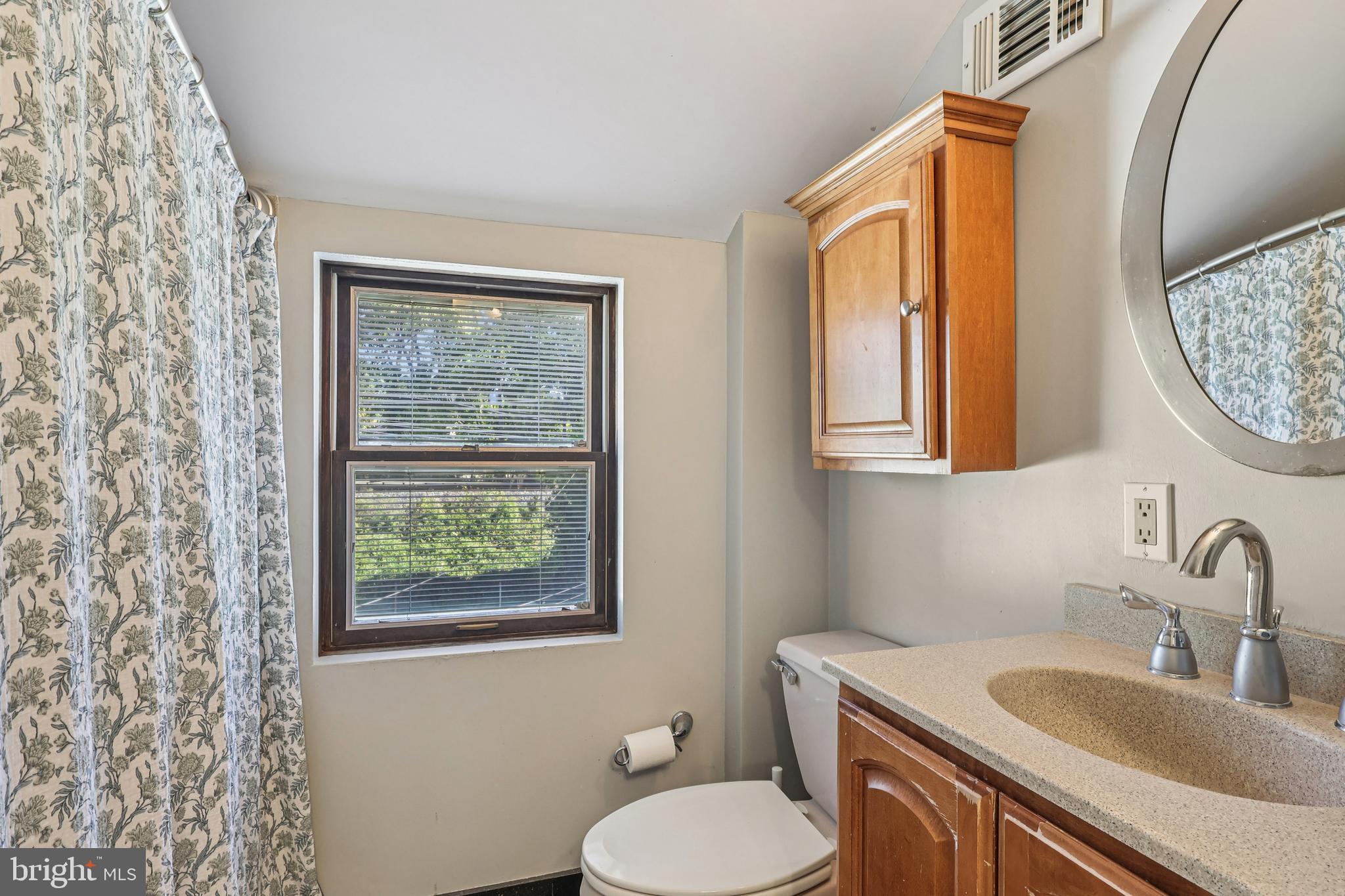 131 Fairfax Road Bryn Mawr, PA 19010 - Photo 21 of 29 a bathroom with a toilet sink and mirror
