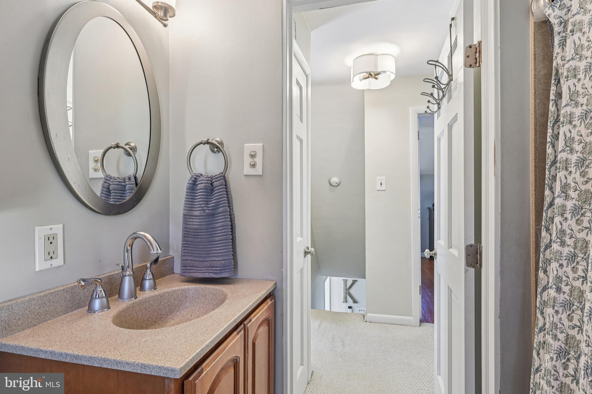 131 Fairfax Road Bryn Mawr, PA 19010 - Photo 22 of 29 a bathroom with a sink and a mirror