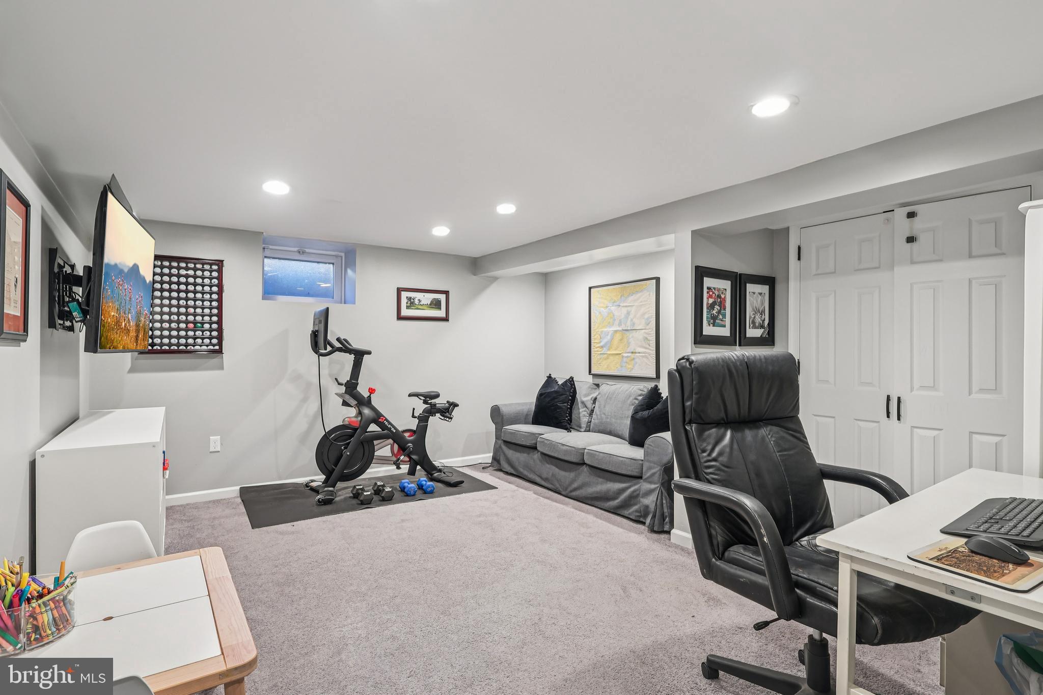 131 Fairfax Road Bryn Mawr, PA 19010 - Photo 24 of 29 a living room with furniture a window and gym equipment