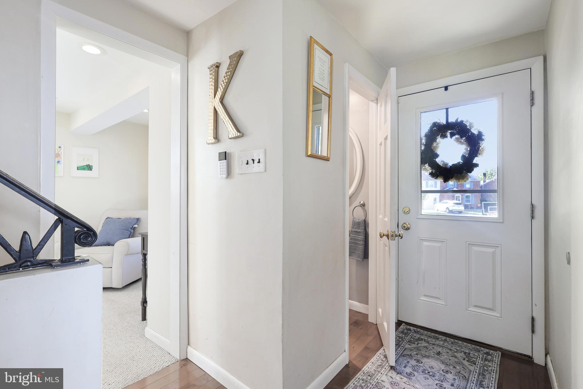 131 Fairfax Road Bryn Mawr, PA 19010 - Photo 26 of 29 a view of a hallway with paintings on the wall