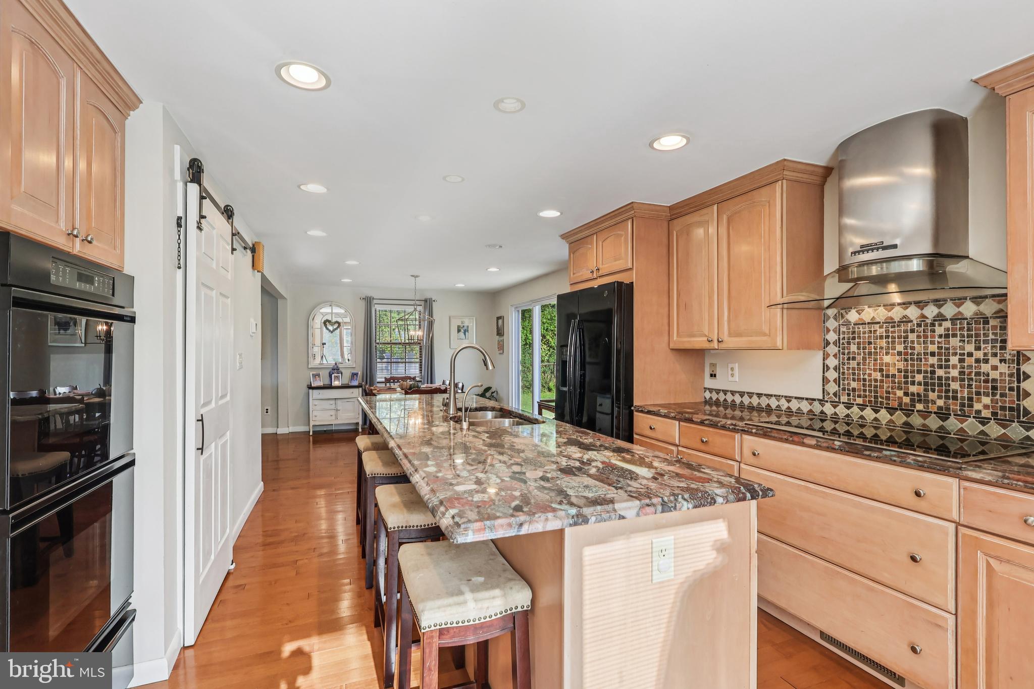 131 Fairfax Road Bryn Mawr, PA 19010 - Photo 9 of 29 a kitchen with sink stove and refrigerator