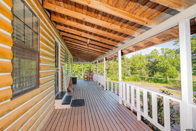 a view of balcony with wooden floor