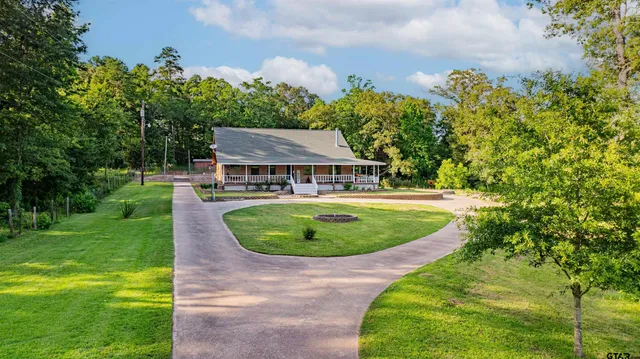 a view of a swimming pool with a yard