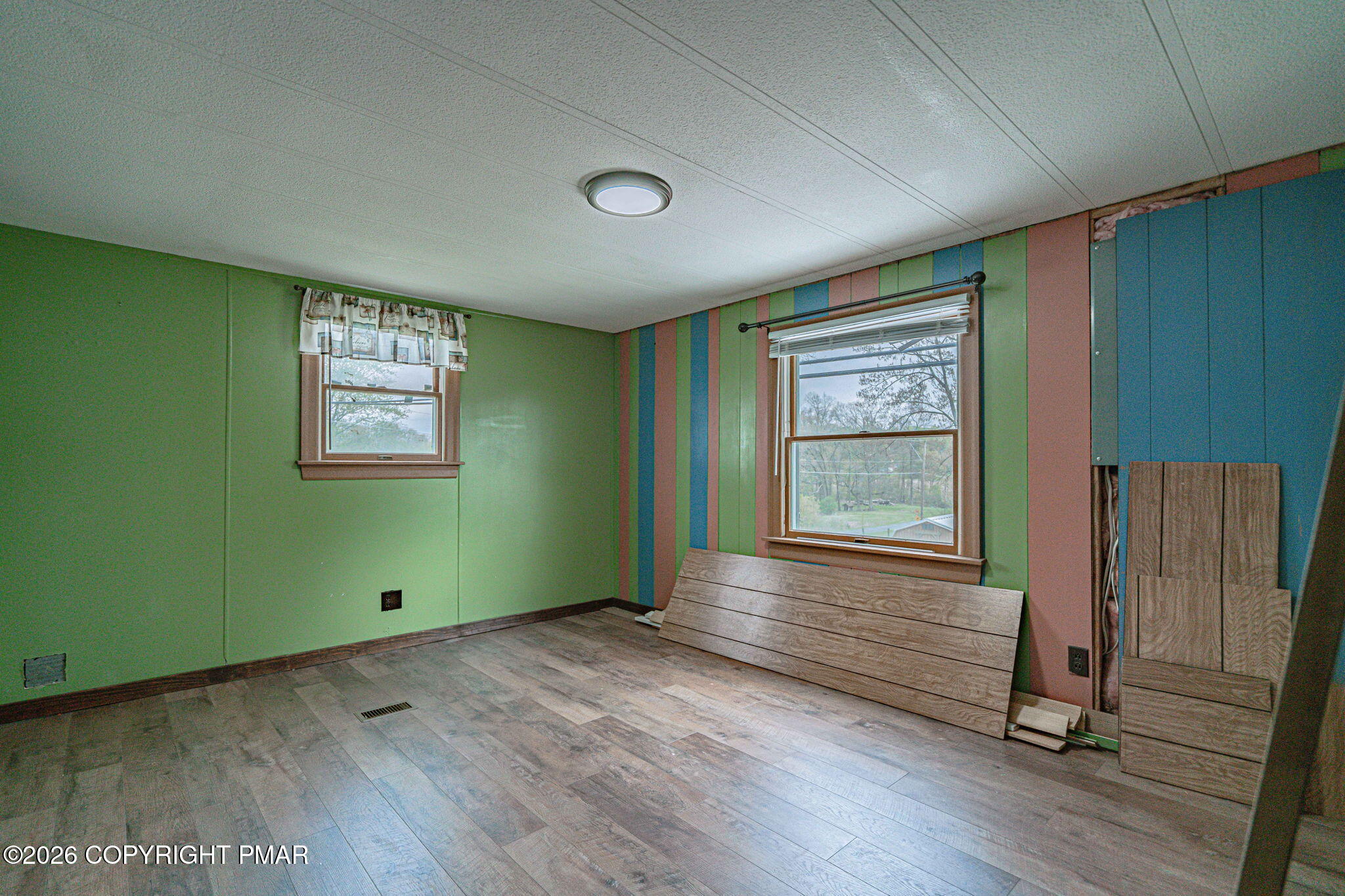 3310 Friedens Road Slatington, PA 18080 - Photo 15 of 38 an empty room with wooden floor and windows