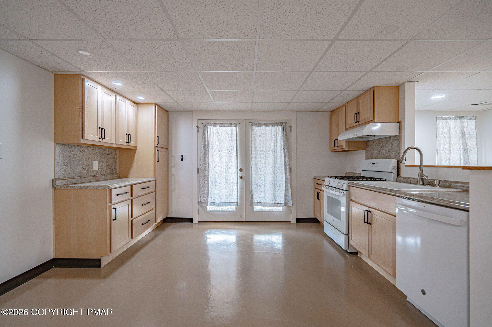 3310 Friedens Road Slatington, PA 18080 - Photo 25 of 38 a kitchen with stainless steel appliances granite countertop a stove a sink and white cabinets
