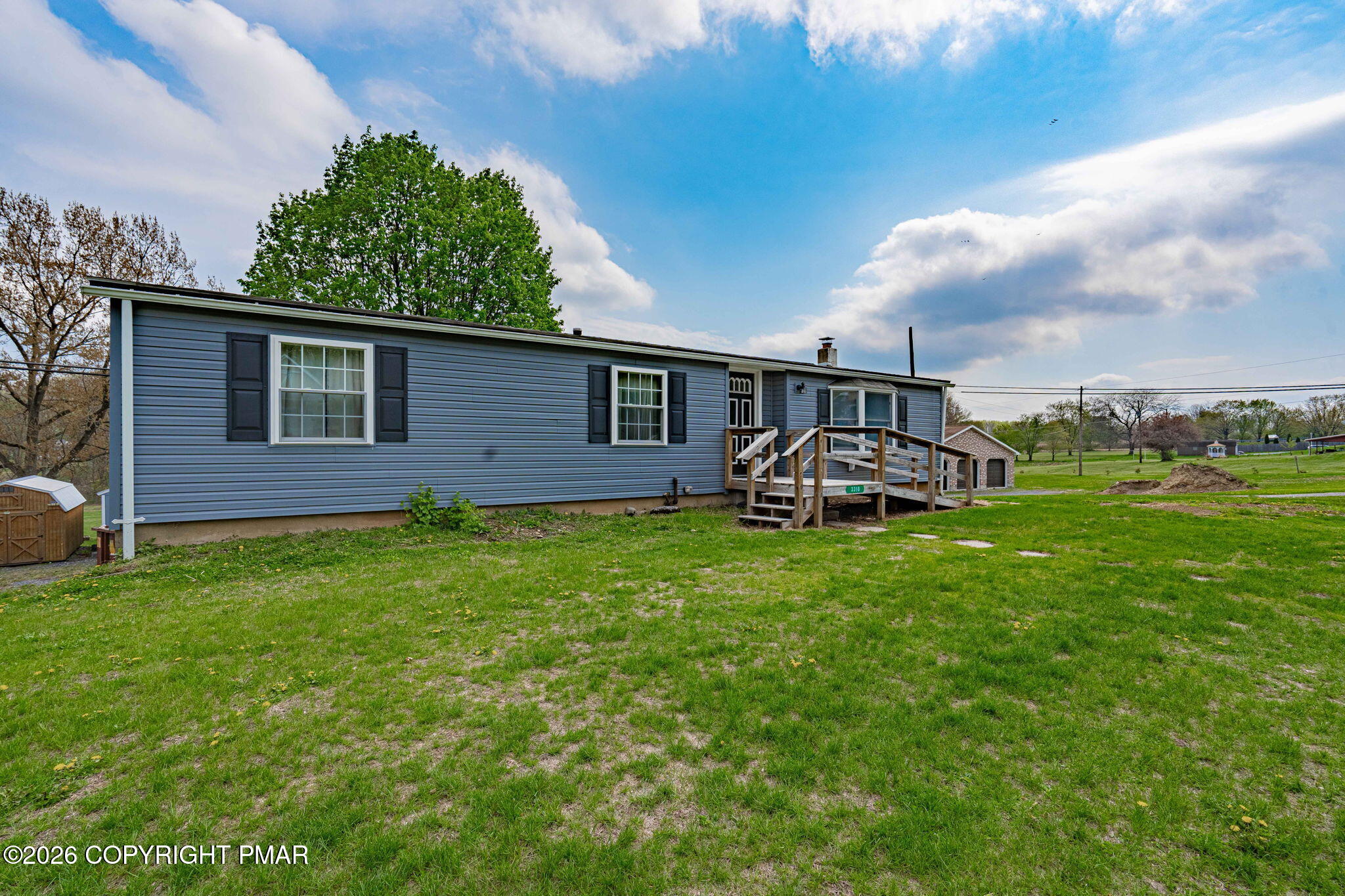 3310 Friedens Road Slatington, PA 18080 - Photo 3 of 38 a front view of a house with garden
