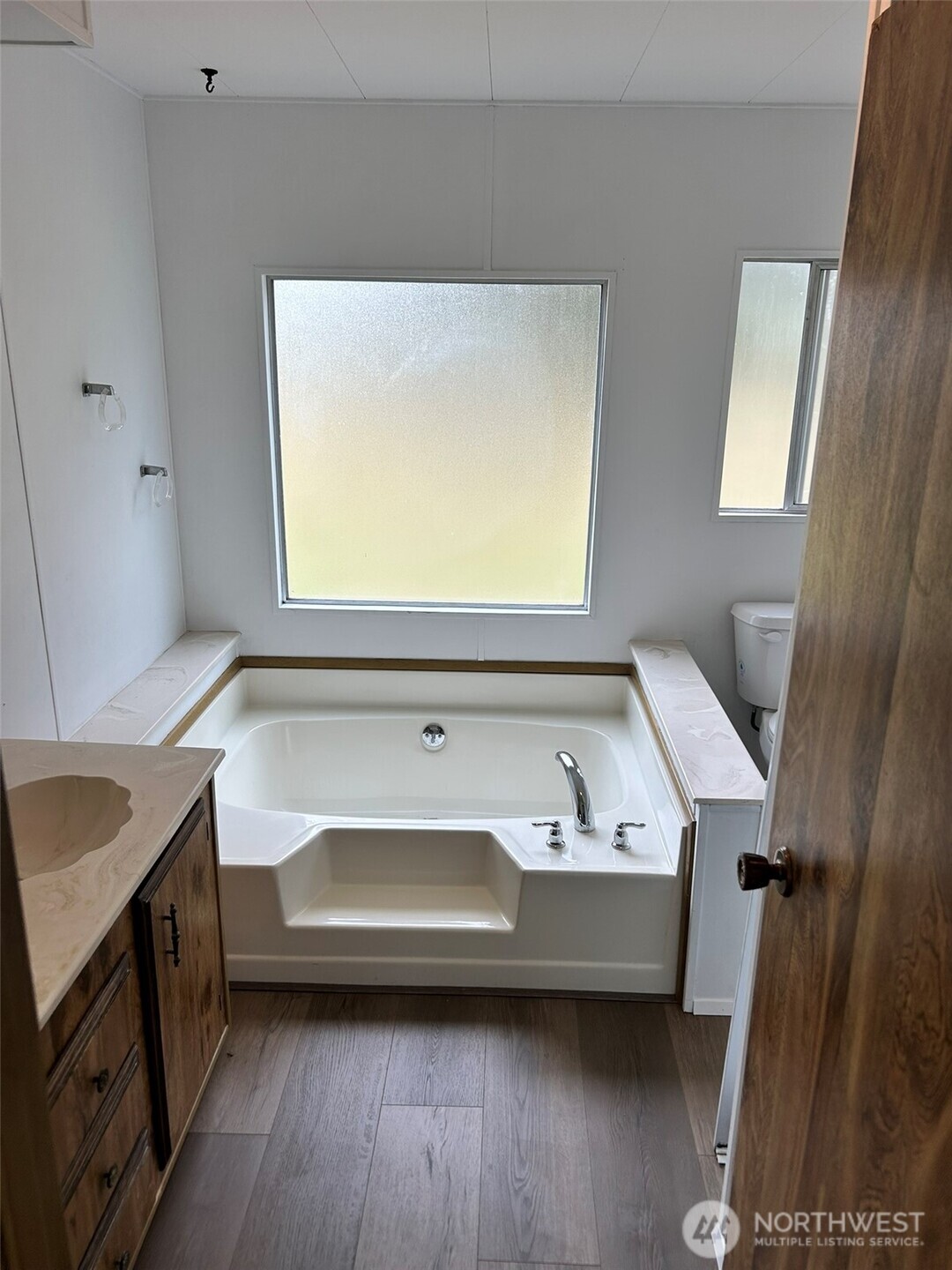 791 Elliot Court Sequim, WA 98382 - Photo 24 of 37 a bathroom with a sink a bath tub and a window
