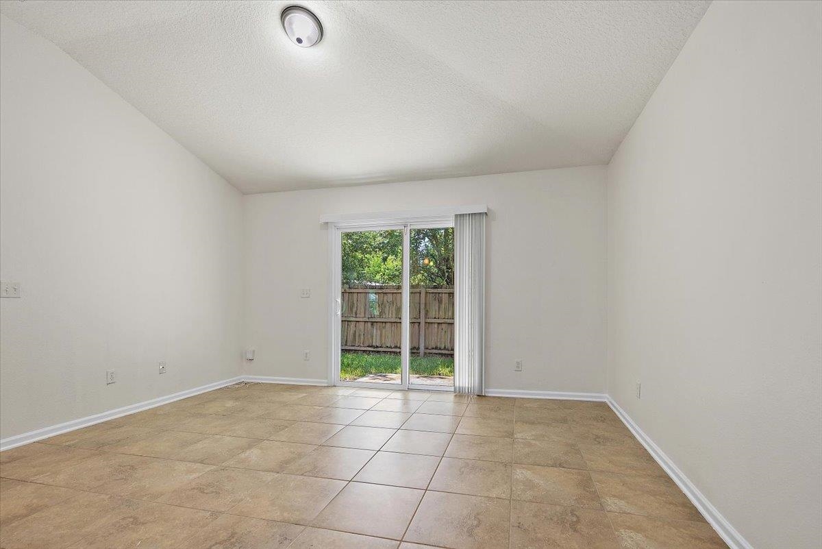 161 Fallen Timber Way St. Augustine, FL 32084 - Photo 8 of 20 an empty room with windows